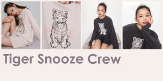 Women wearing cozy tiger print sweaters from the Tiger Snooze Crew collection