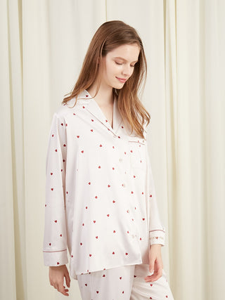 The Louxourious loungewear by Gelato Pique USA Sweet Heart Pattern Satin Shirt is a stylish pajama shirt with a pink heart pattern and smooth satin fabric. 